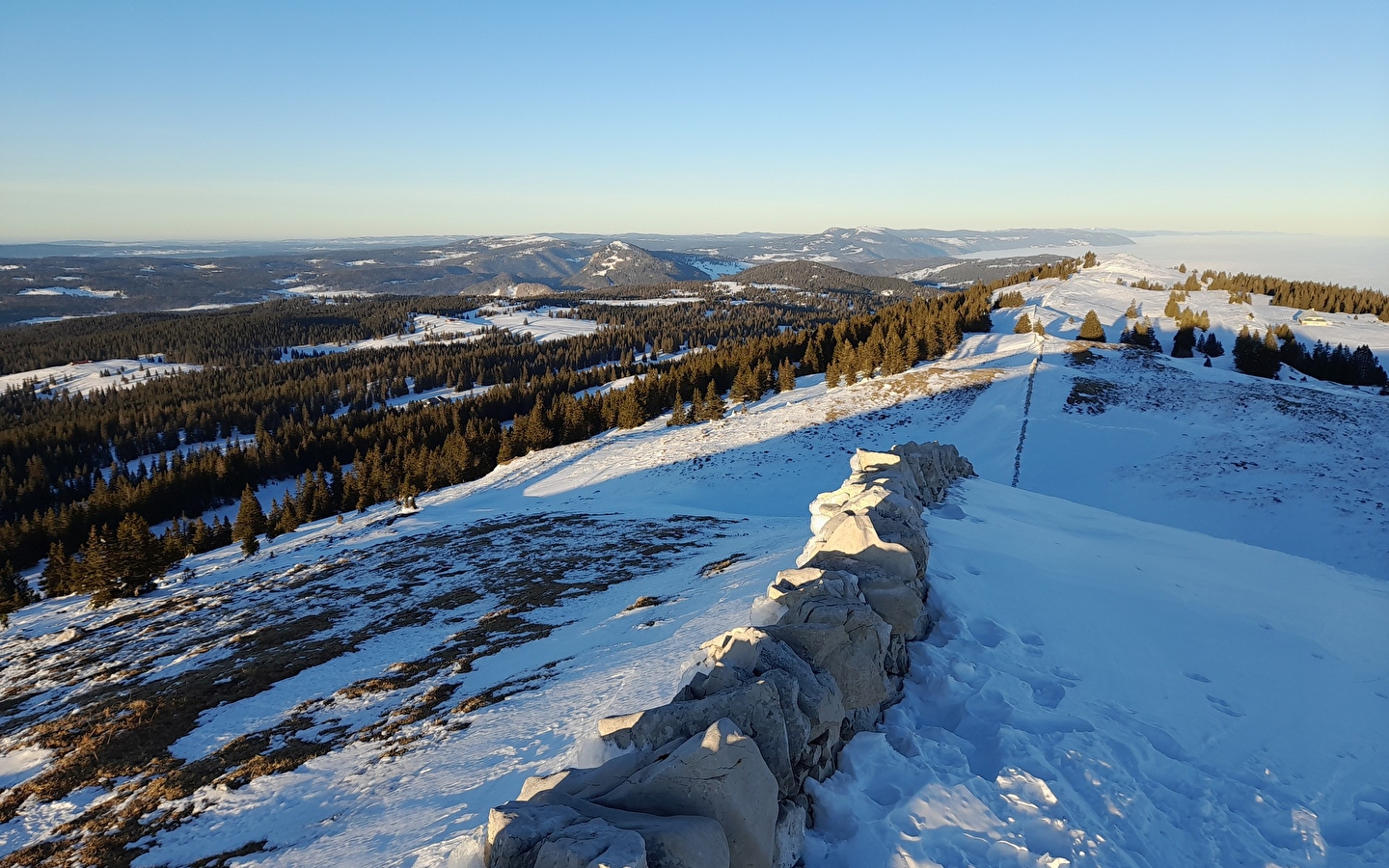 Snowshoeing in the wide open spaces of the Swiss Jura